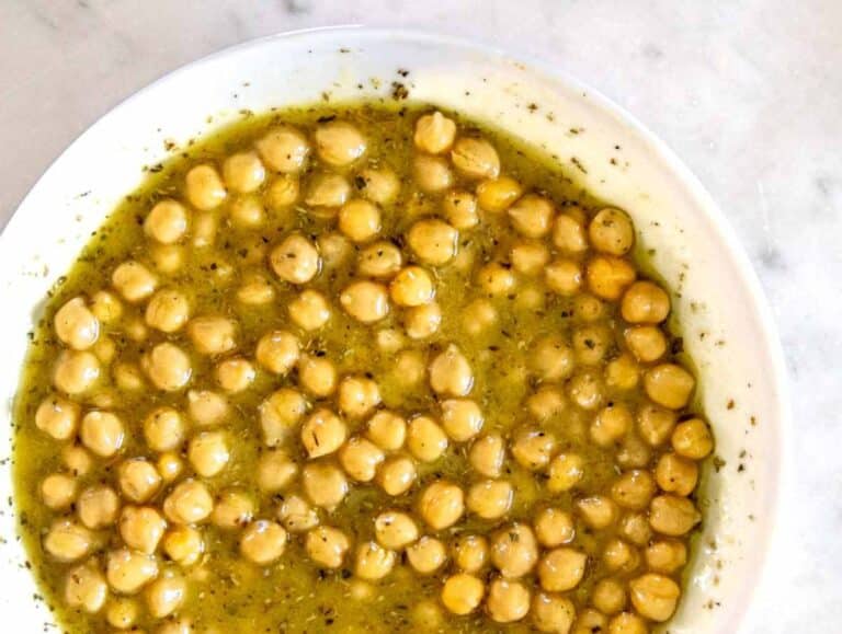 Step 2 Chickpeas marinating in olive oil vinegar dressing for chickpea cucumber salad.
