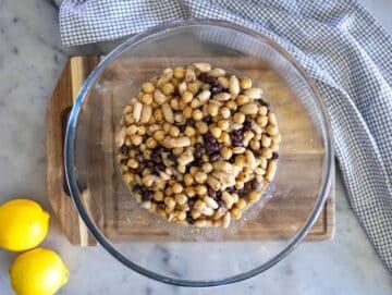 Step 2 Marinating beans in dressing for high protein bean salad before adding vegetables.