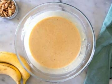 Step 2 Mashing ripe bananas with eggs yogurt peanut butter sugar and vanilla in mixing bowl.
