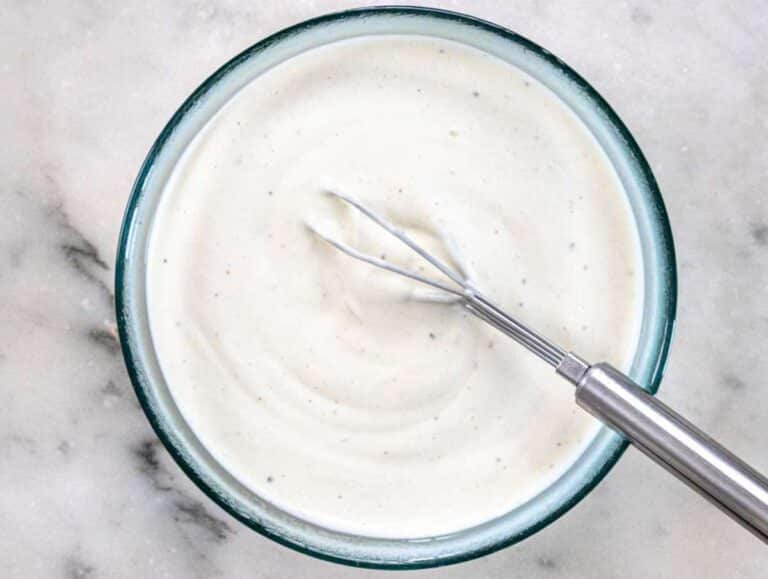 Step 2 Mixing Greek yogurt mayo vinegar and honey in a bowl for salad dressing.