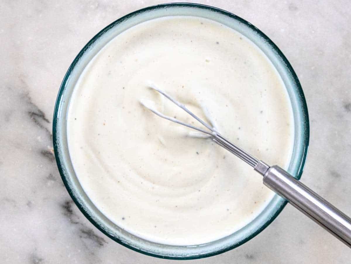 Step 2 Mixing Greek yogurt mayo vinegar and honey in a bowl for salad dressing.
