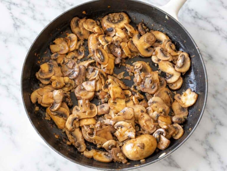 Step 2 Sliced mushrooms cooking with onion and garlic until soft and browned.