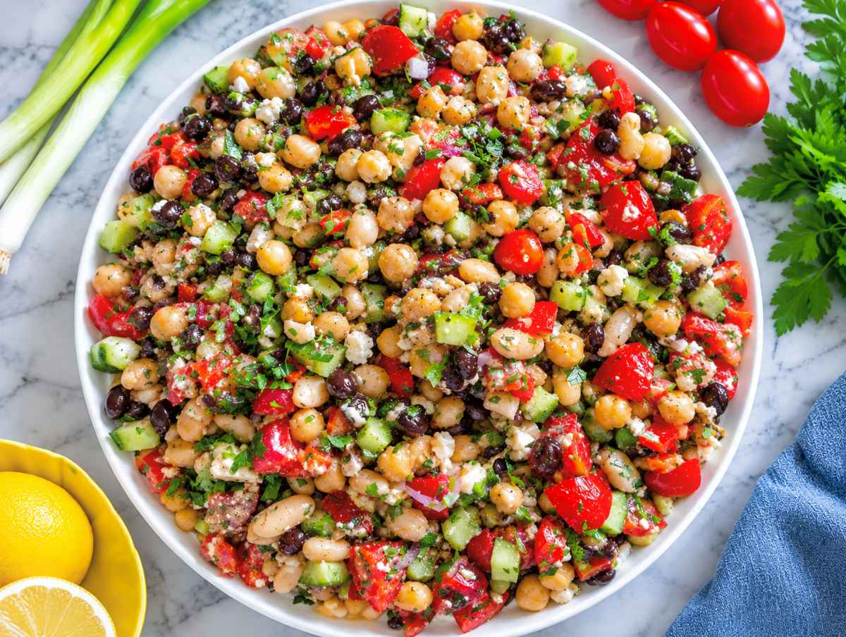 Step 3 Marinated beans tossed with colorful vegetables, parsley, and crumbled feta.