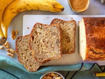 Step 4 Baked protein banana bread sliced on a marble cutting board ready for a snack.