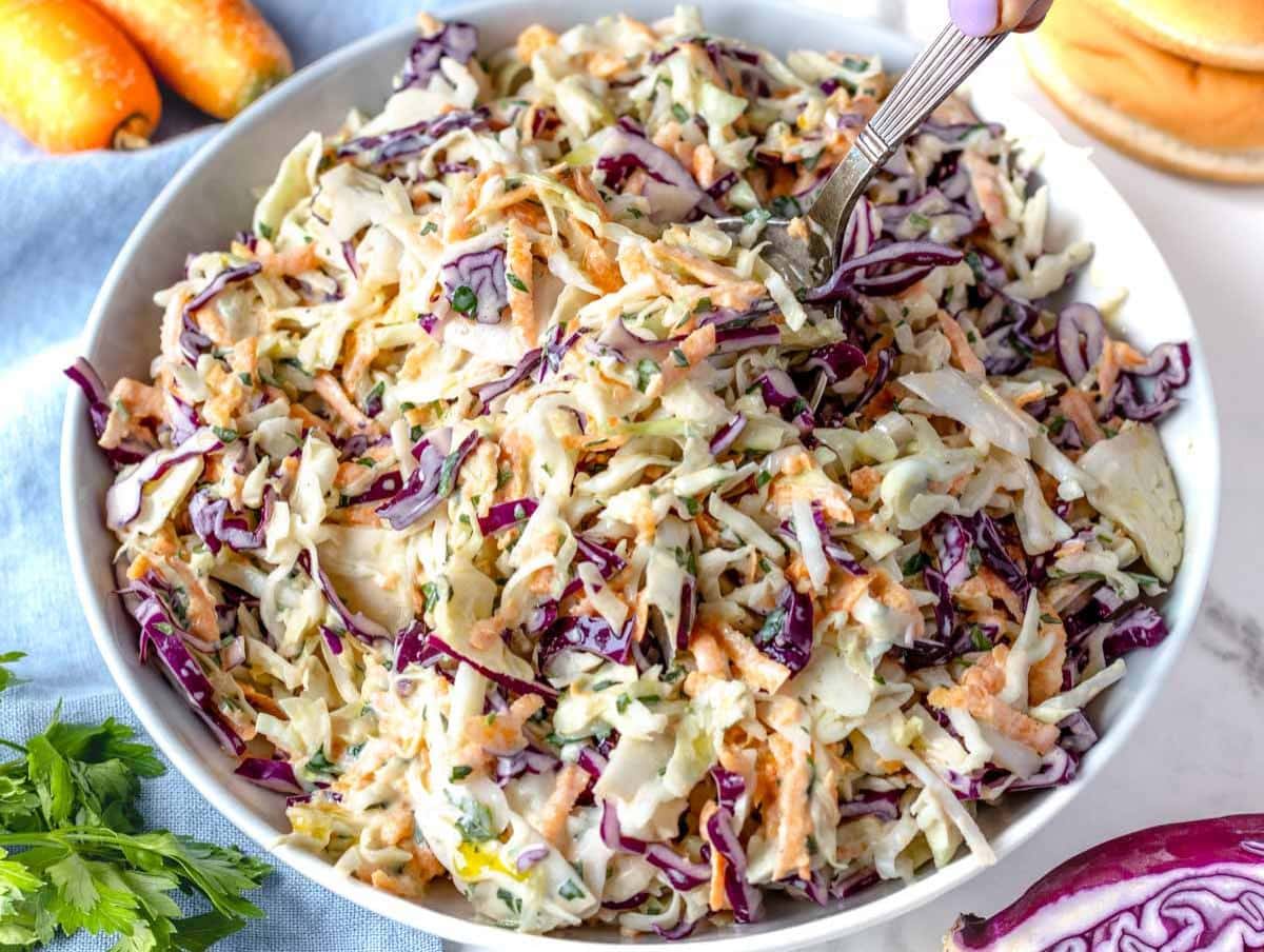 Step 4 Chilled coleslaw served in a bowl ready to enjoy as a summer side dish.
