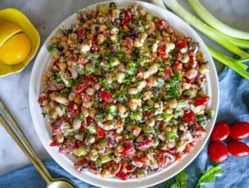 Step 4 High-protein dense bean salad served on a white platter.