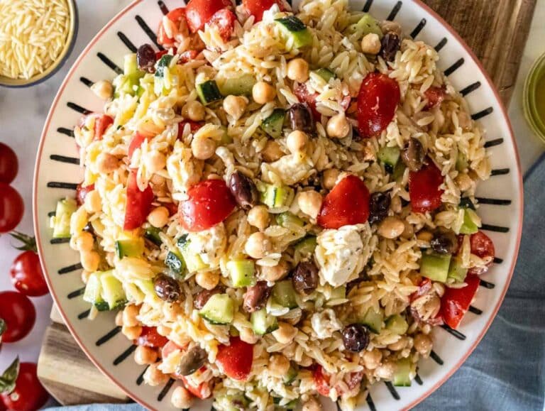 Step 5 Greek orzo salad with marinated chickpeas served on a platter.