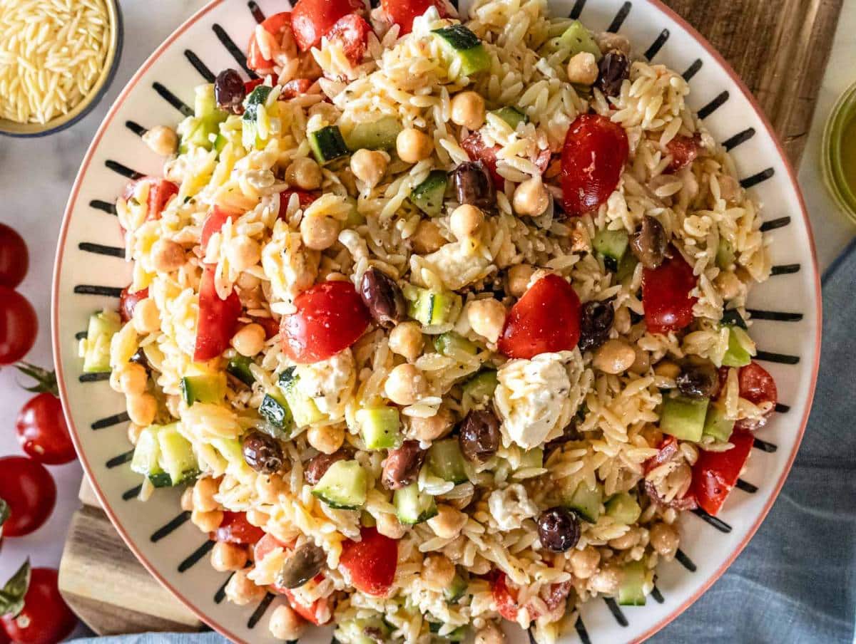 Step 5 Greek orzo salad with marinated chickpeas served on a platter.