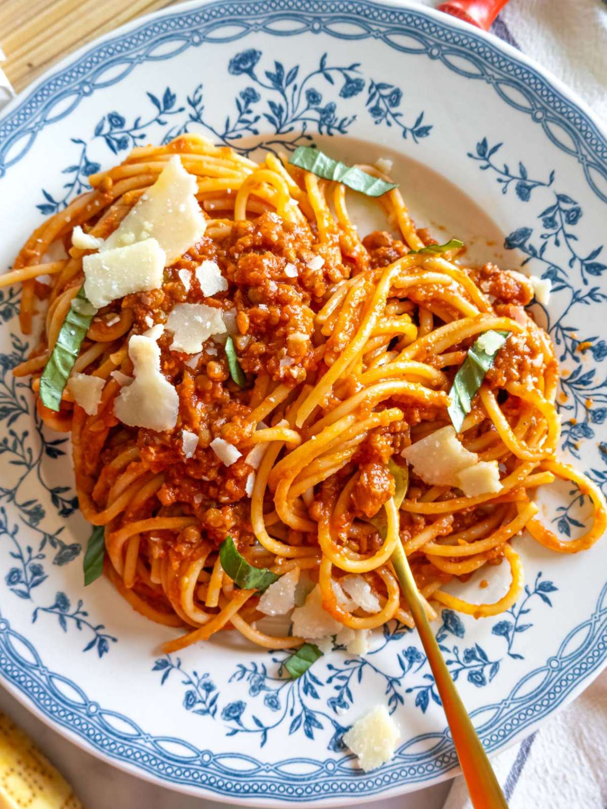Top down view of hearty lentil bolognese with spaghetti.