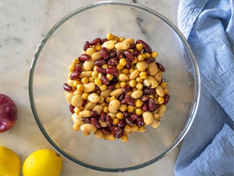 Warm kidney beans cannellini beans and chickpeas tossed in zesty salad dressing.