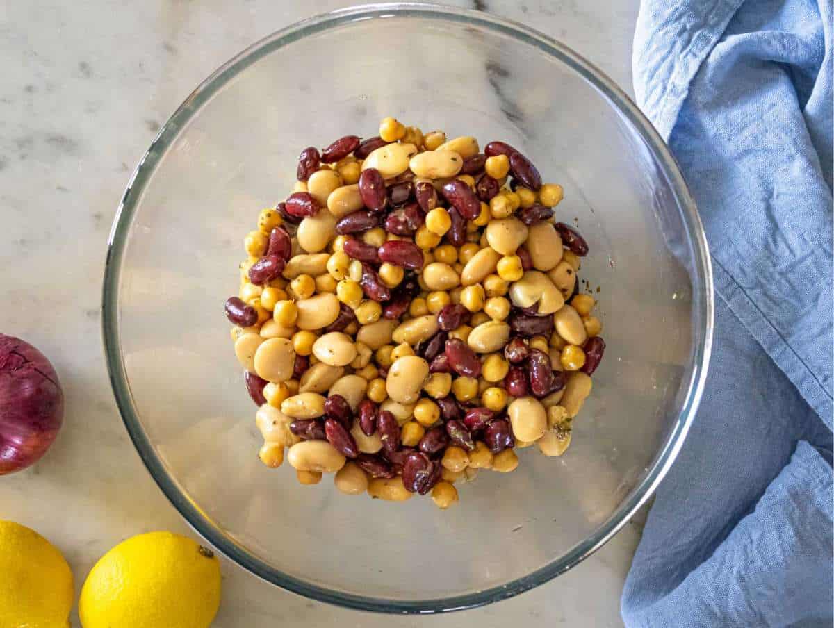Warm kidney beans cannellini beans and chickpeas tossed in zesty salad dressing.