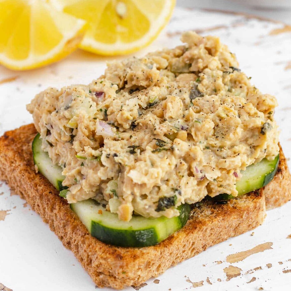 vegan tuna on a slice of bread and cucumbers
