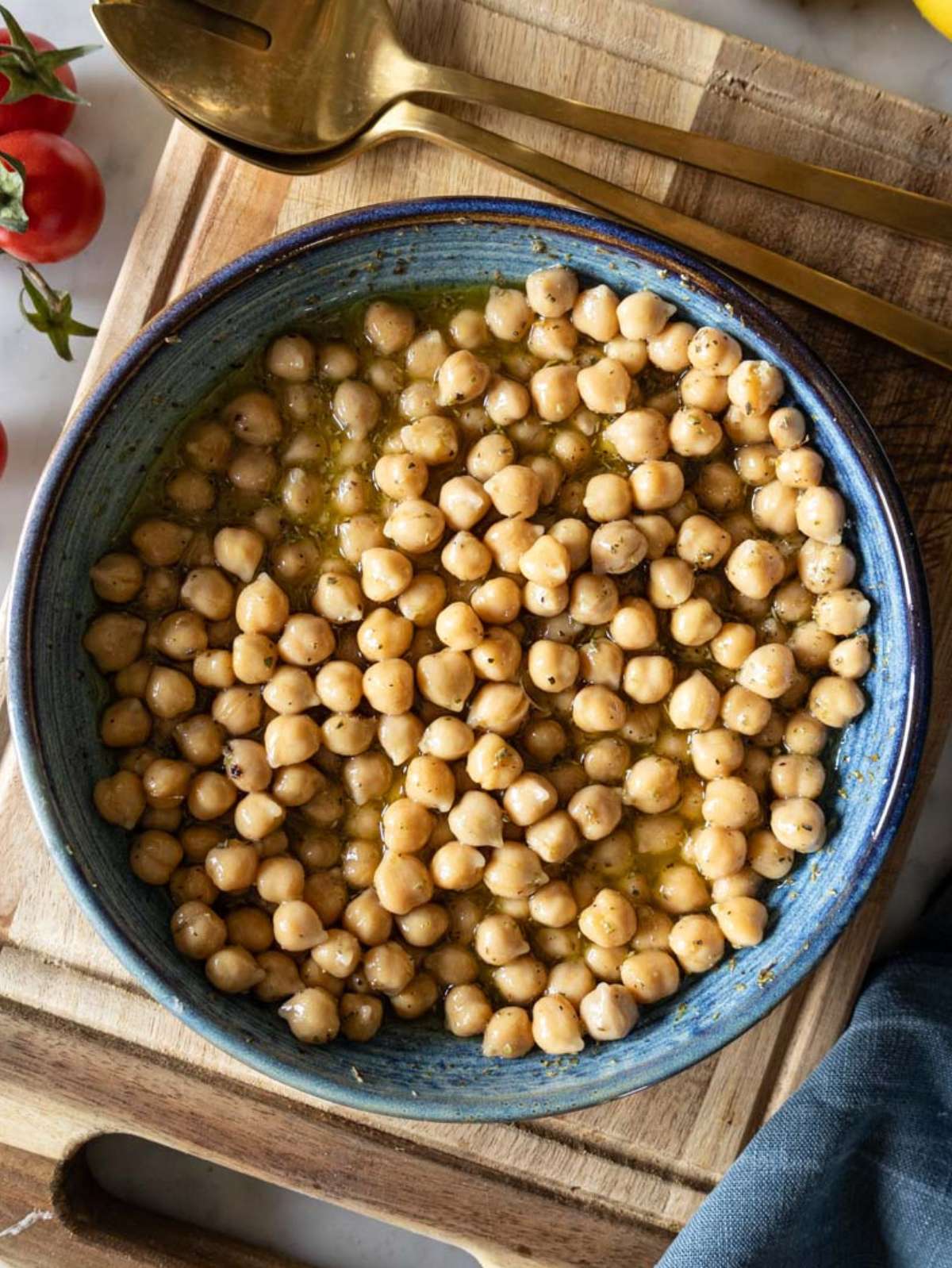 Close up of marinated chickpeas in honey mustard dressing getting ready for the carrot chickpea salad.