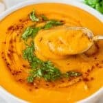 Creamy lentil soup served with lemon parsley and crusty bread for a cozy dinner.