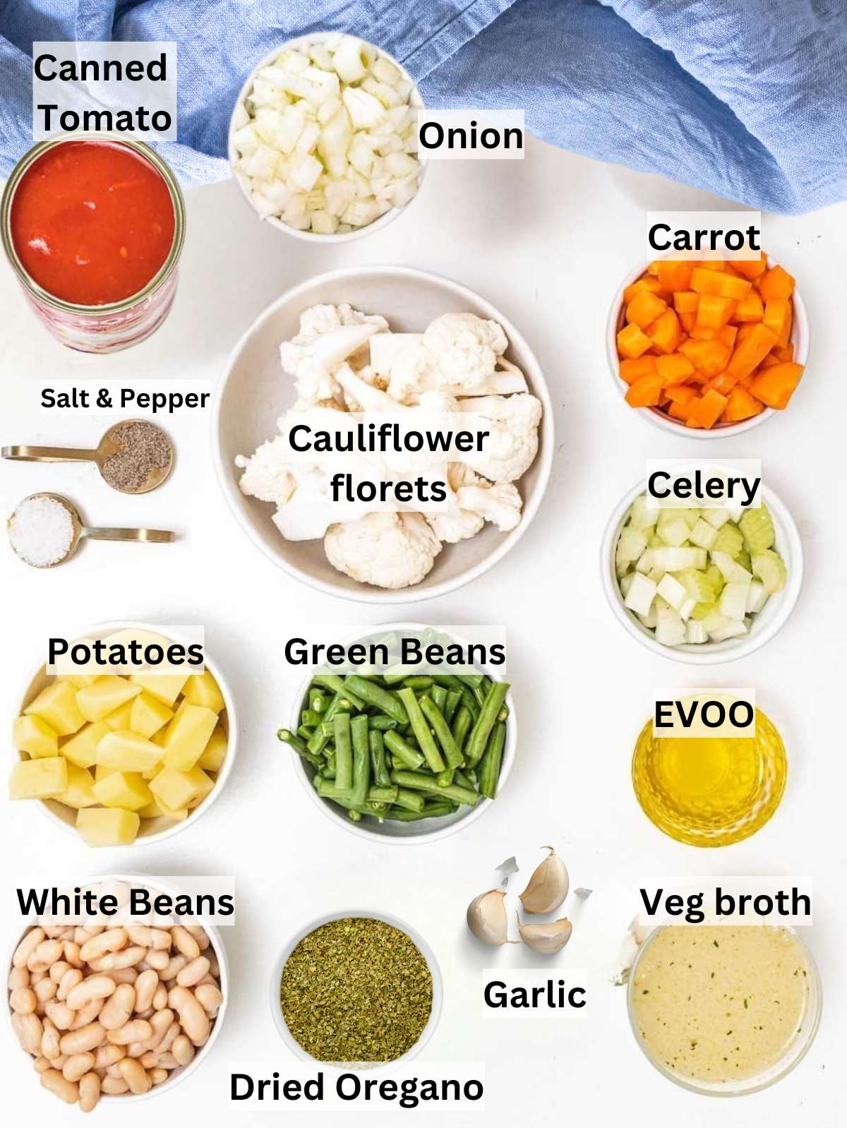 Fresh chopped vegetables beans potatoes and broth ingredients for healthy vegetable soup recipe.