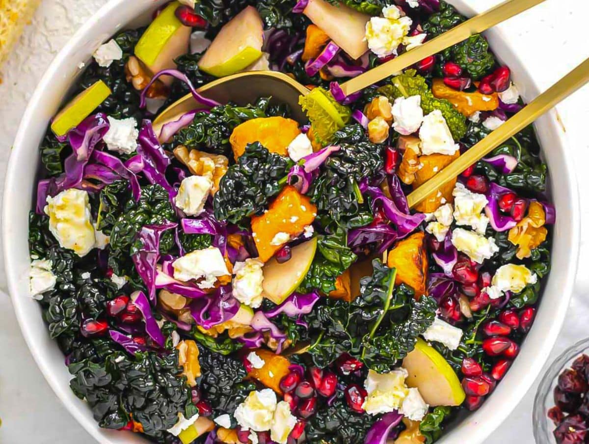 Fresh healthy butternut squash kale salad with honey mustard vinaigrette perfect for fall gatherings.