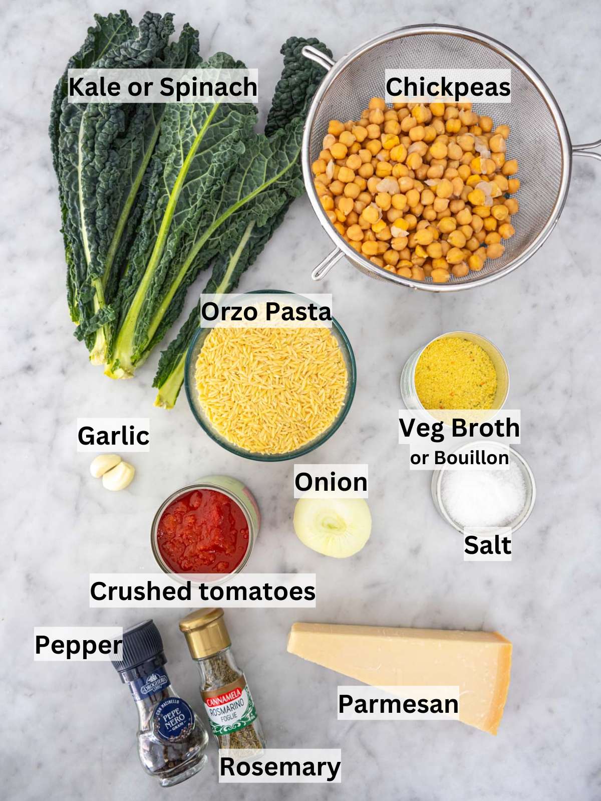 Fresh ingredients for Tuscan Orzo with Chickpeas and Kale arranged on a table.