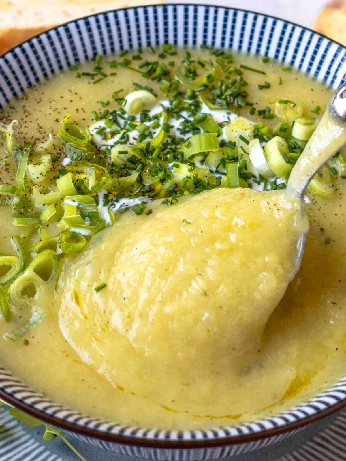 Healthy creamy potato soup with Greek yogurt in a bowl close up view.
