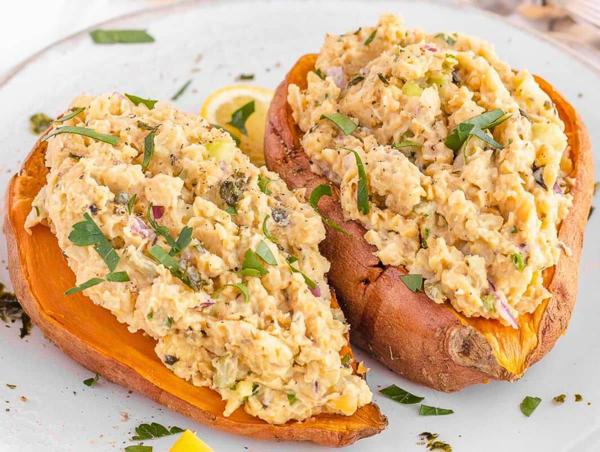 Healthy mashed chickpea salad with Greek yogurt on sweet potatoes for a high-protein lunch.