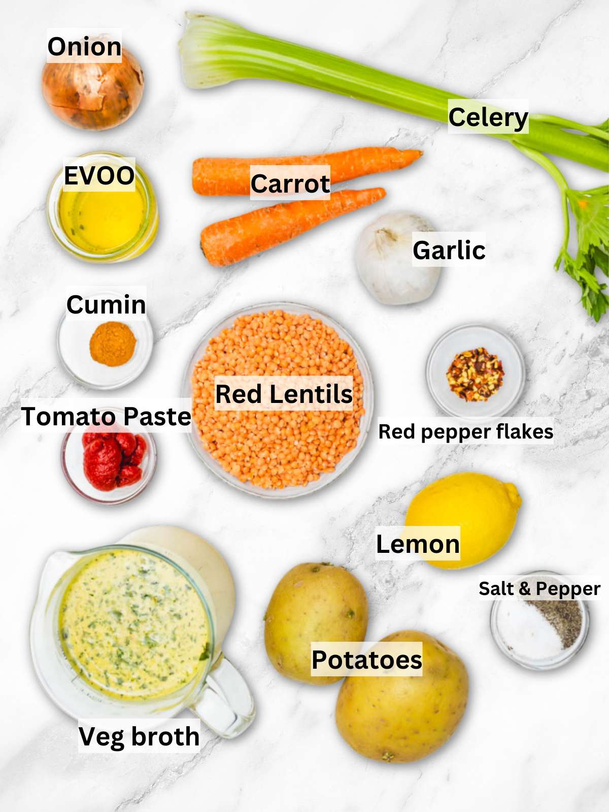 Ingredients for creamy lentil soup with red lentils potatoes vegetables spices and lemon.