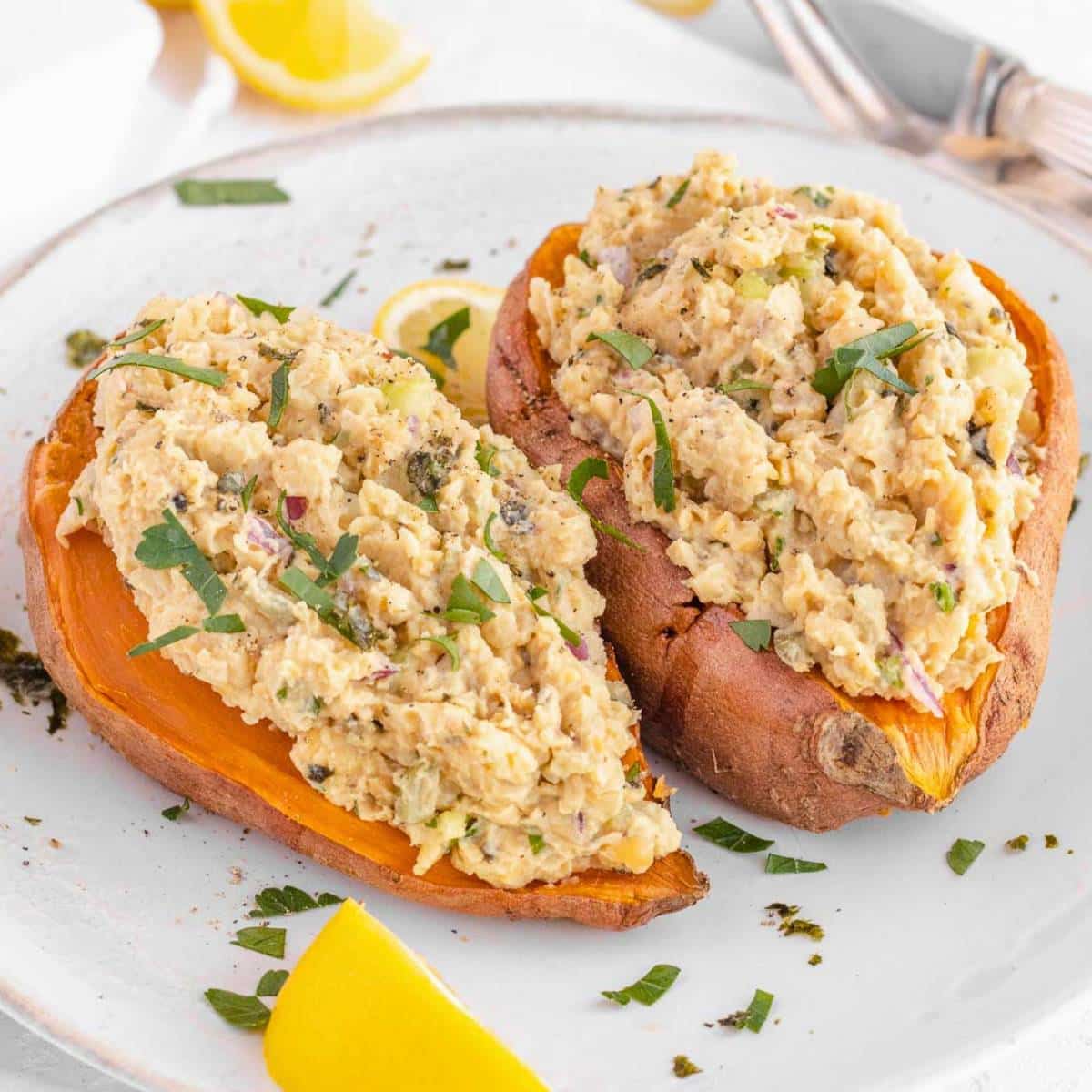 Mashed chickpea salad with Greek yogurt served with sweet potatoes for healthy high-protein lunch.