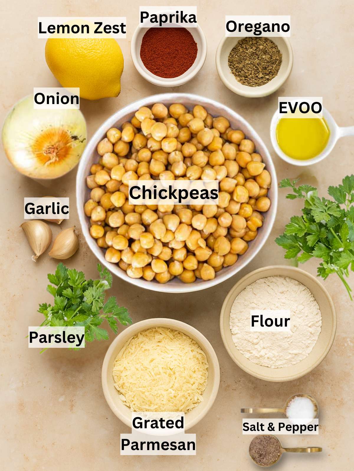 Overhead shot of ingredients for Greek chickpea patties including chickpeas onion herbs and cheese.