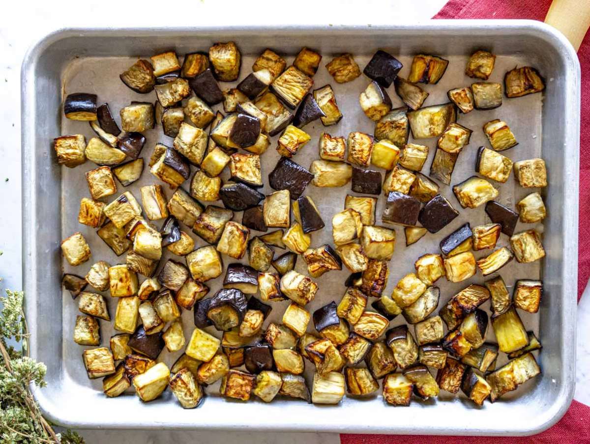 Step 1 Cubed eggplant roasted on a baking sheet until golden and tender.