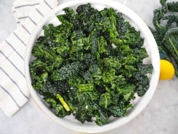 Step 1 Massaged kale leaves with lemon and salt in large mixing bowl.