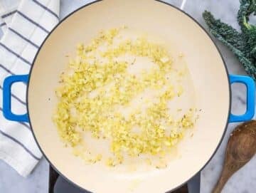Step 1 Onion garlic and rosemary sautéing for Tuscan Orzo with Chickpeas and Kale.