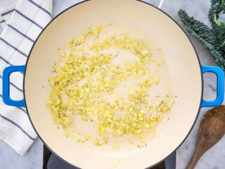 Step 1 Onion garlic and rosemary sautéing for Tuscan Orzo with Chickpeas and Kale.