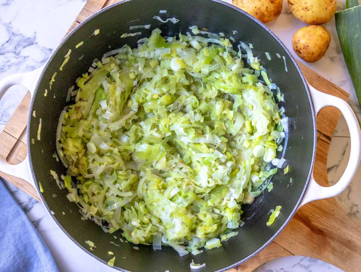 Step 1 Sliced leeks and onion cooking in olive oil for potato soup base.