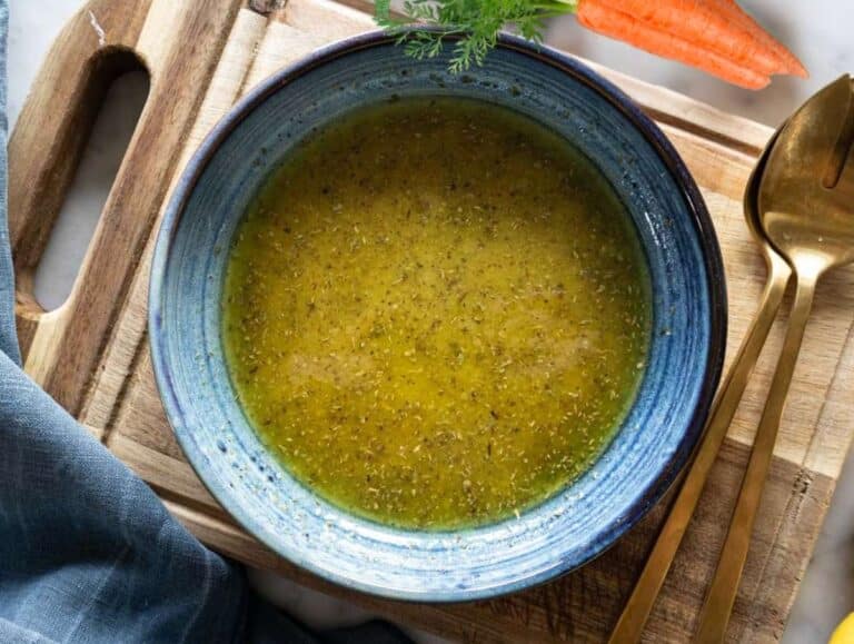Step 1 Whisking olive oil vinegar mustard honey and oregano into creamy honey mustard dressing.