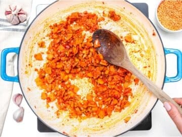 Step 1 cooking onion carrot celery and garlic in olive oil with tomato paste and cumin.