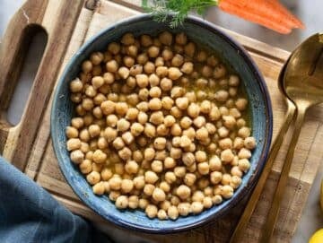 Step 2 Chickpeas marinating in honey mustard dressing for extra flavor before adding vegetables.