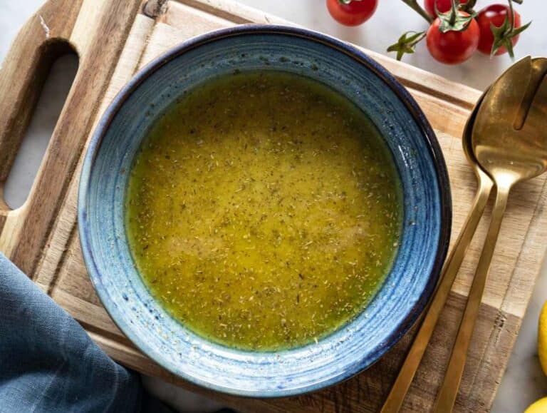 Step 2 Homemade honey mustard dressing whisked in a blue bowl.