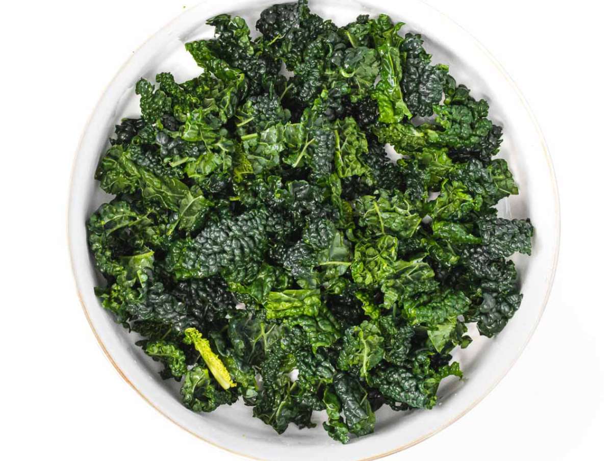 Step 2 Kale leaves chopped and massaged with lemon juice and salt in a large bowl.