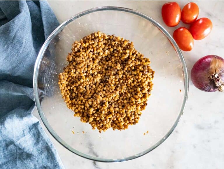 Step 2 Lentils marinating in dressing with herbs for extra flavor before adding vegetables.