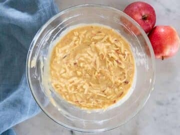 Step 2 greek yogurt peanut butter eggs sugar and grated apples whisked in large bowl.