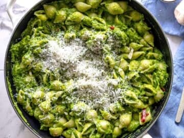 Step 3 Pasta tossed in creamy smashed broccoli sauce with parmesan and pasta water in skillet.