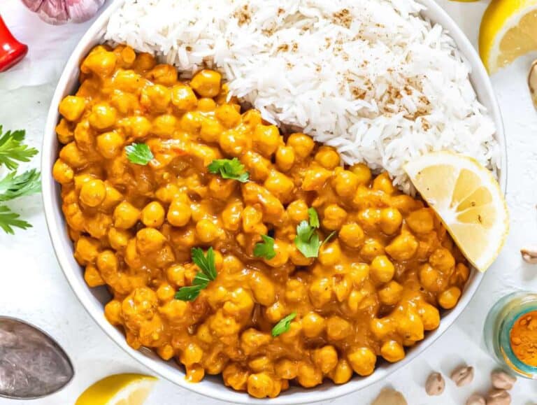 Step 3 Serve coconut curry with chickpeas in bowl with rice cilantro and yogurt topping.