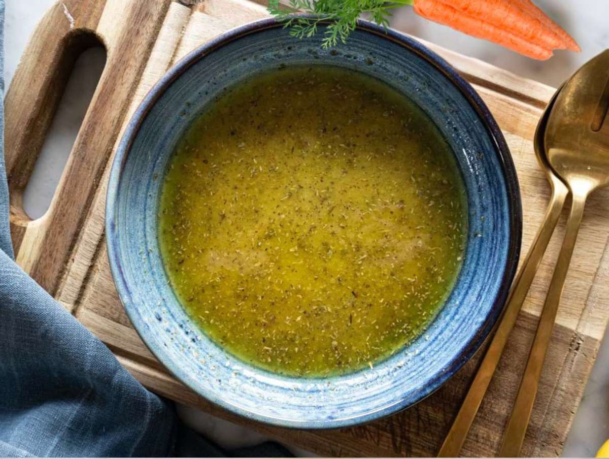 Step 3 Whisking olive oil mustard honey vinegar and oregano in small bowl for the dressing.