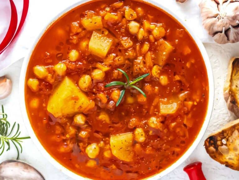 Step 4 Bowl of Mediterranean chickpea soup served with bread.