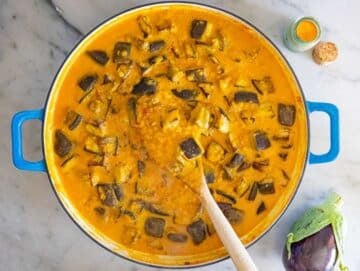 Step 4 Roasted eggplant and coconut milk stirred into the pot to make curry creamy.