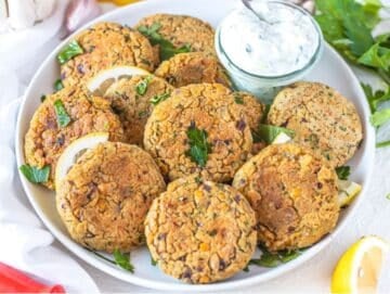 Step 4 Serving chickpea patties on platter with lemon parsley and dipping sauce.