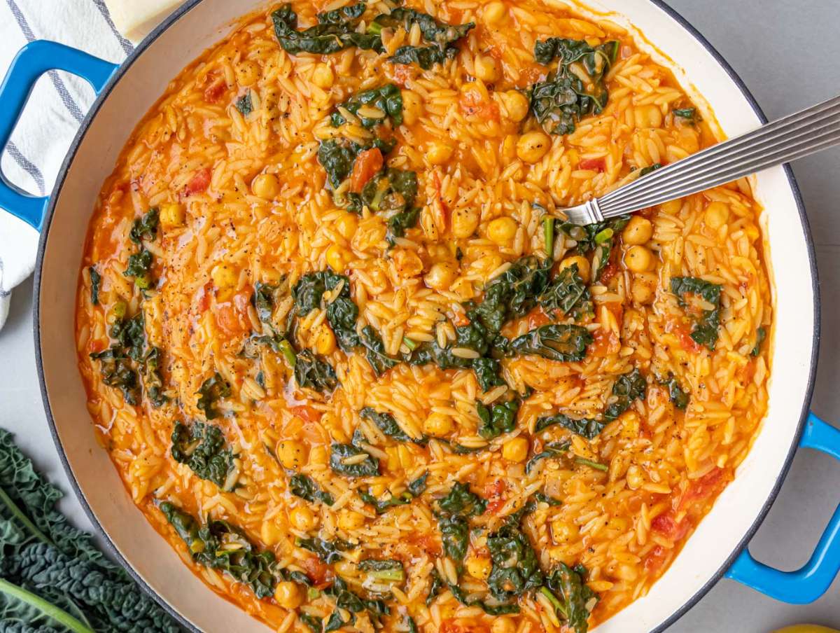 Step 4 Tuscan Orzo with Chickpeas and Kale finished with parmesan and lemon zest.