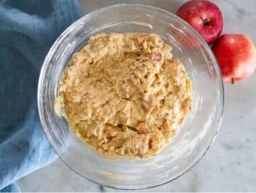 Step 4 cinnamon sugar diced apples folded into muffin batter.