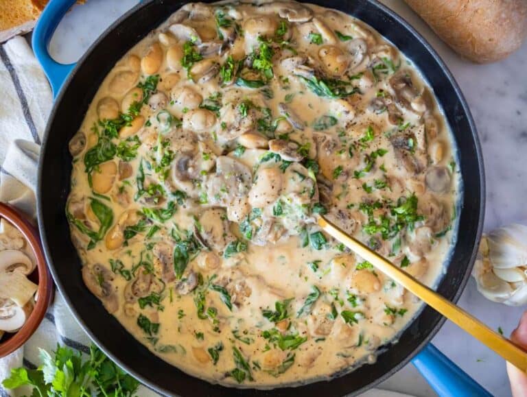 Step 5 Serving creamy Marsala butter beans garnished with parsley alongside crusty bread for dinner.