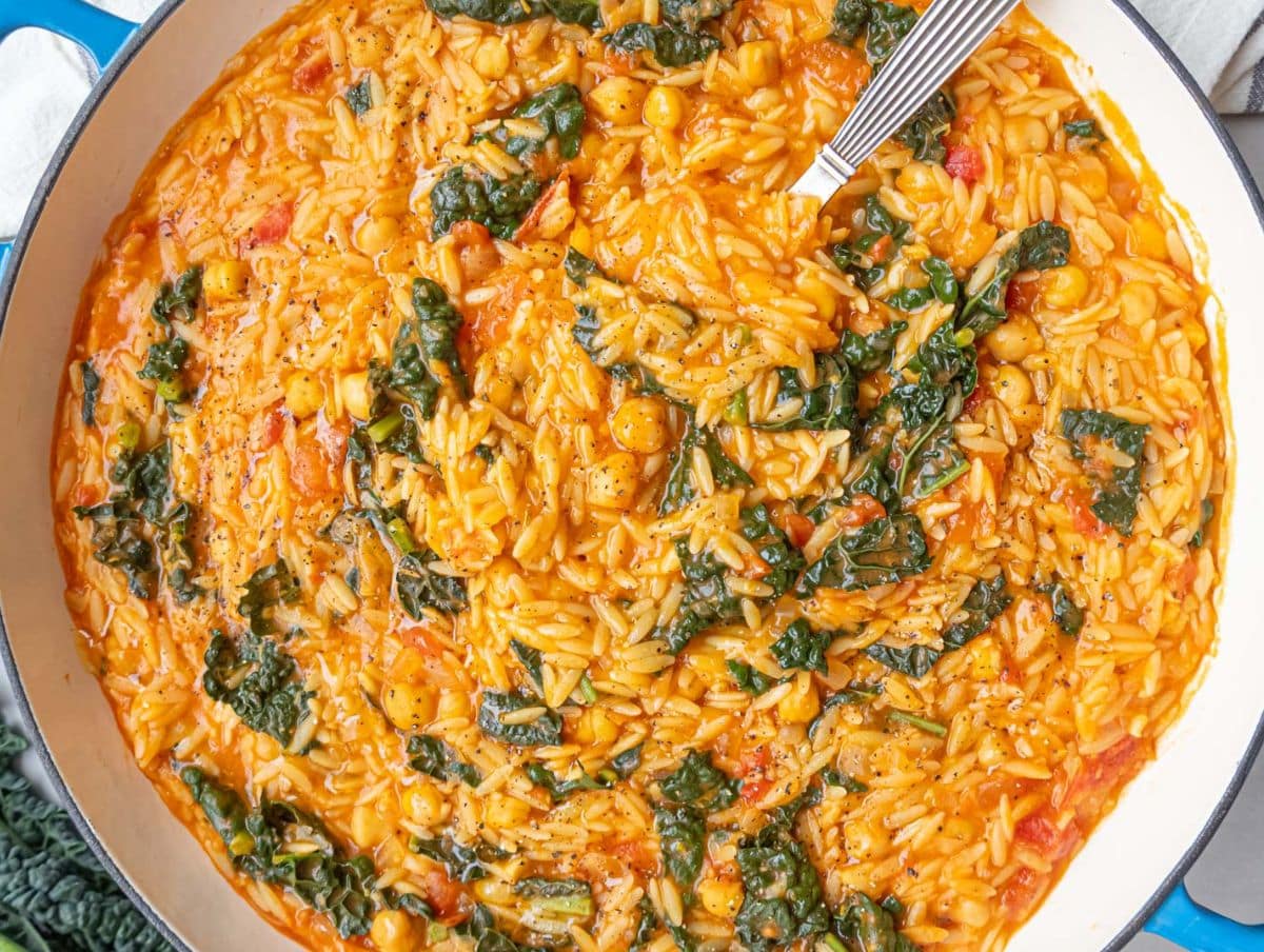 Tuscan Orzo with Chickpeas and Kale topped with olive oil and lemon zest.