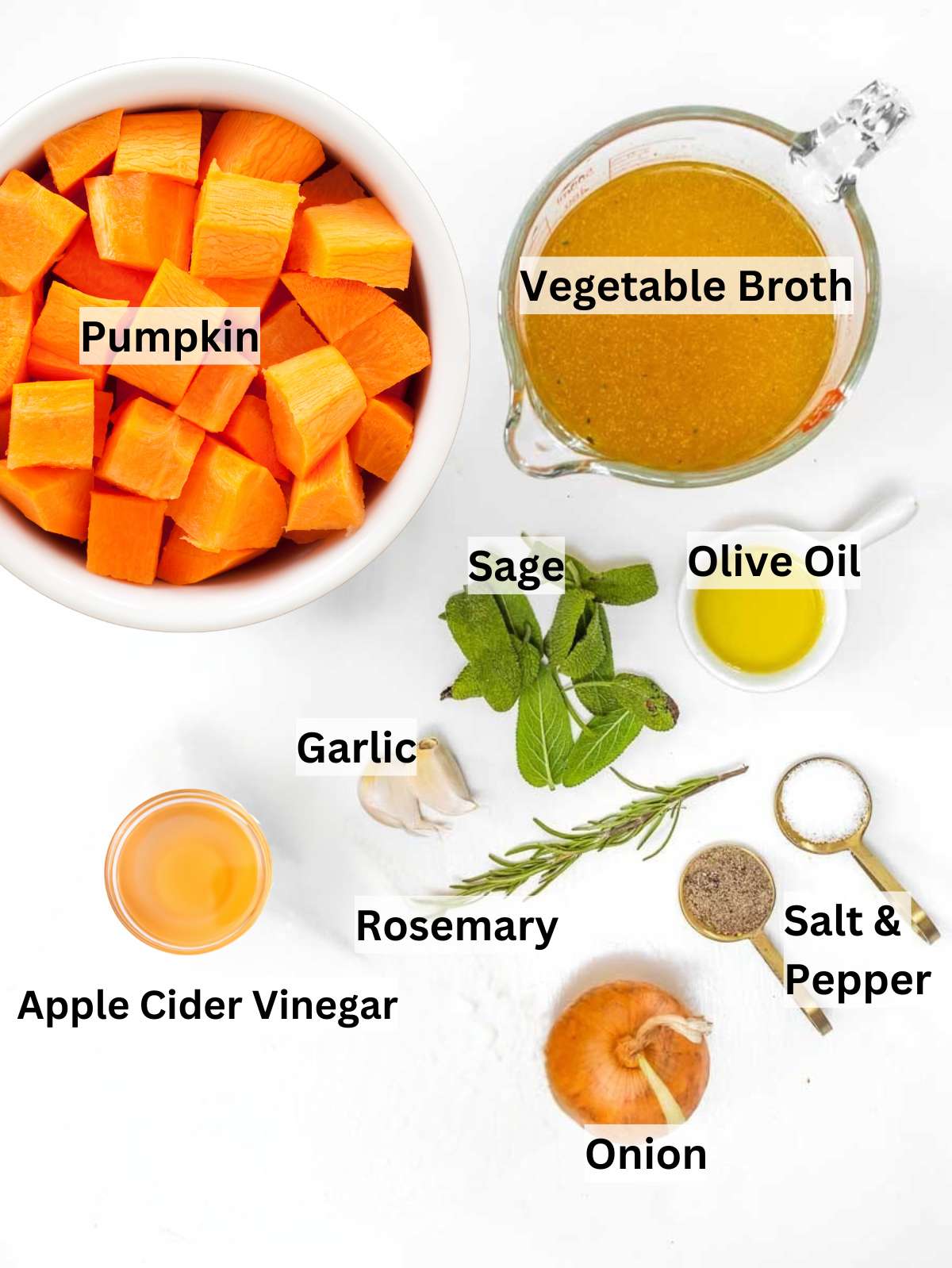 Chopped pumpkin onion garlic rosemary sage and olive oil ready for Mediterranean pumpkin soup.