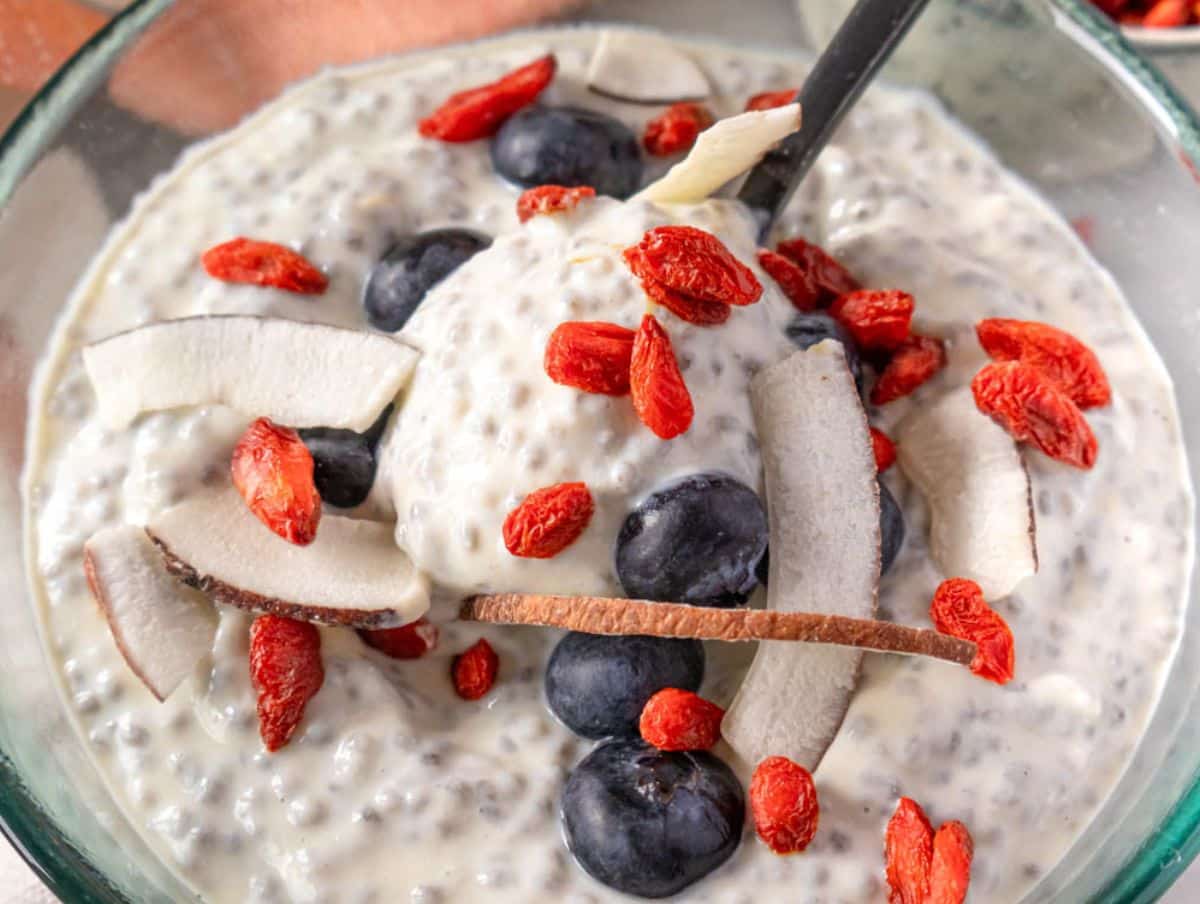 Easy make ahead breakfast Greek yogurt chia pudding with colorful toppings.